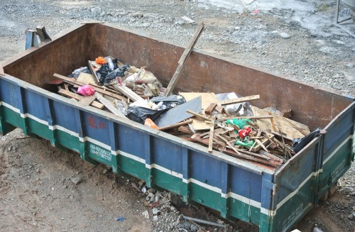 Waste disposal team handling bulky rubbish collection in London