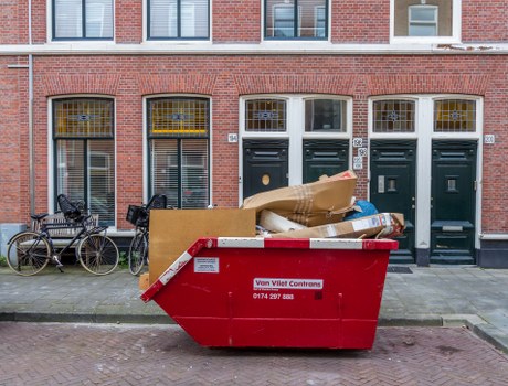 Team removing large household items from a London property