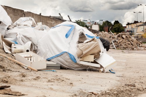 Waste collection team handling rubbish removal in a London street