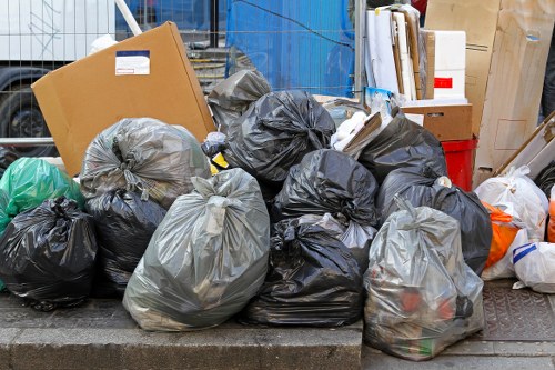Bulk waste collection team removing large household items in a London property