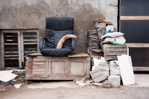 Local crew removing a large sofa from a London property