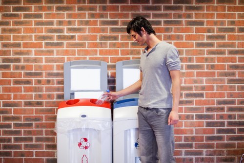 Rubbish removal crew loading builders’ waste from a London home renovation