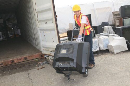 A London collection team handling waste in a narrow street with limited access