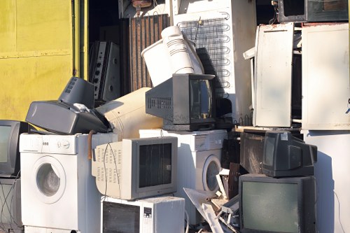 Supervisor checking safety procedures before a rubbish removal task