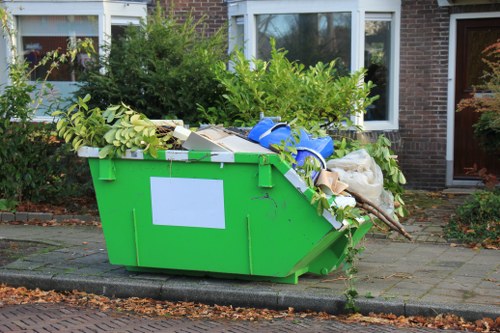 Removing an old washing machine for recycling in London