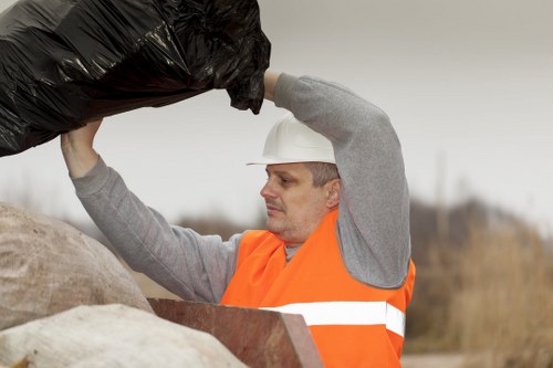 Staff managing business recycling and general waste in an urban London setting